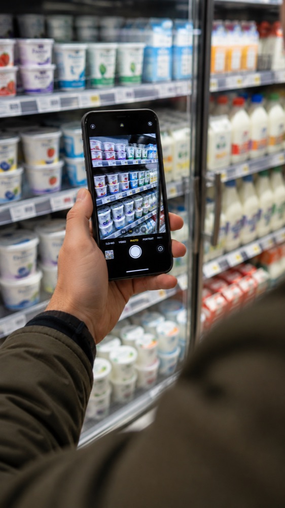 Holding a phone up to a chilled supermarket shelf